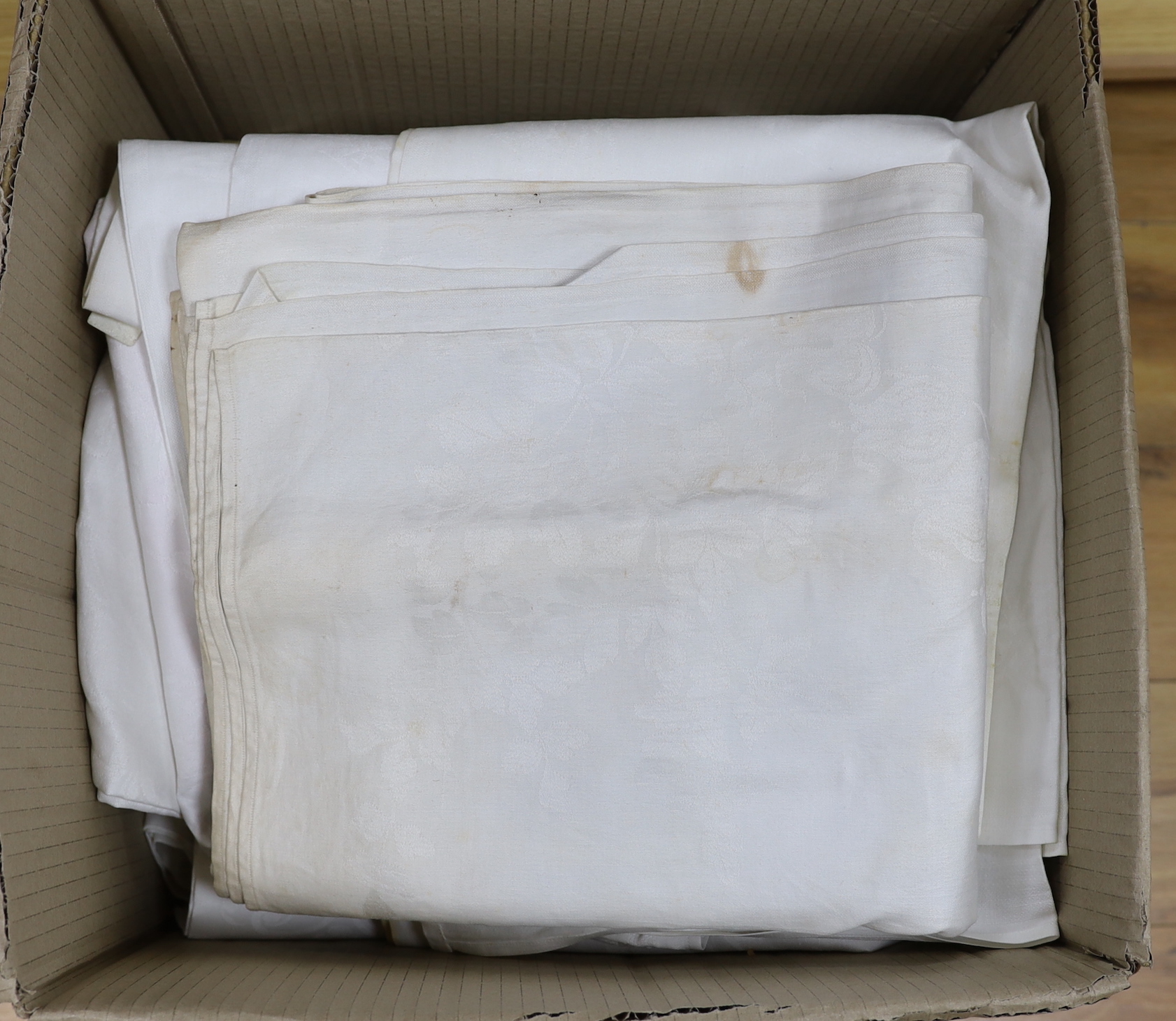 Ten mixed sized and designed damask banqueting table cloths